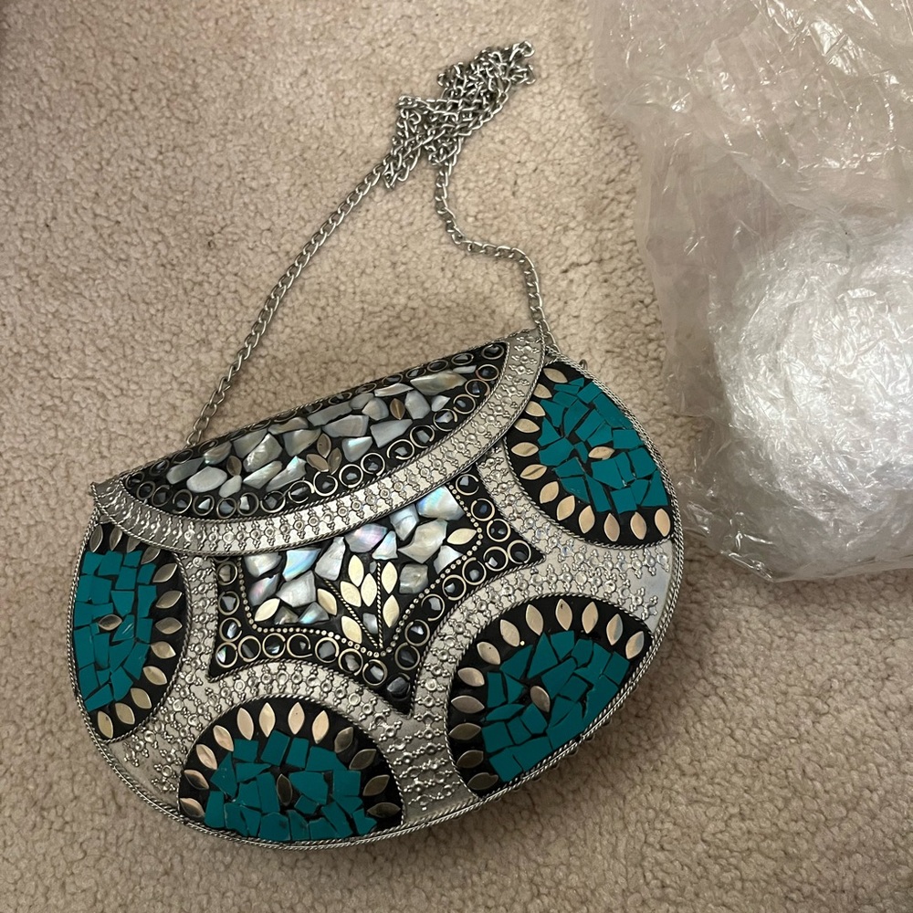 Metal small over the shoulder handbag with turquoise design. New.